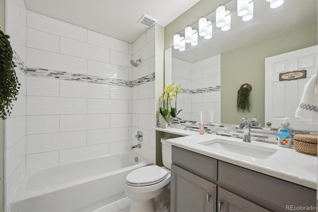 bathroom featuring visible vents, backsplash, toilet, shower / tub combination, and vanity