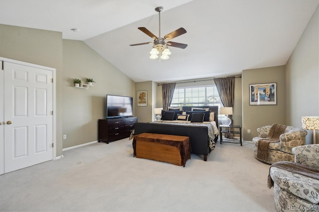 bedroom featuring lofted ceiling, light colored carpet, baseboards, and ceiling fan