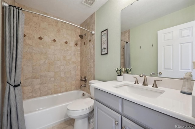 bathroom featuring visible vents, toilet, shower / tub combo with curtain, tile patterned floors, and vanity