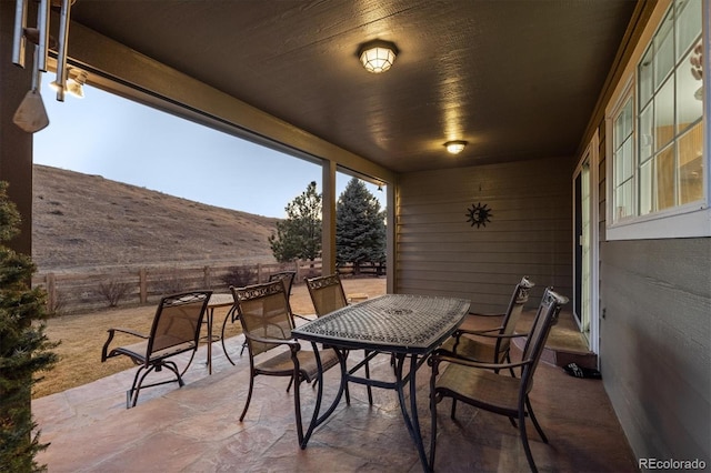 view of patio / terrace with outdoor dining area and fence