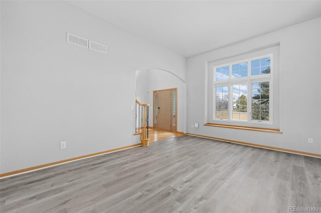 spare room featuring light hardwood / wood-style floors