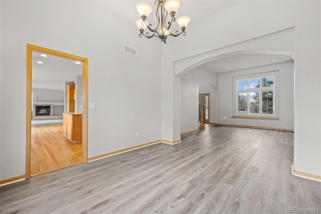 interior space featuring hardwood / wood-style floors and a notable chandelier