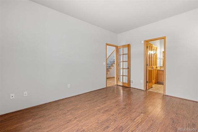 spare room with light wood-type flooring