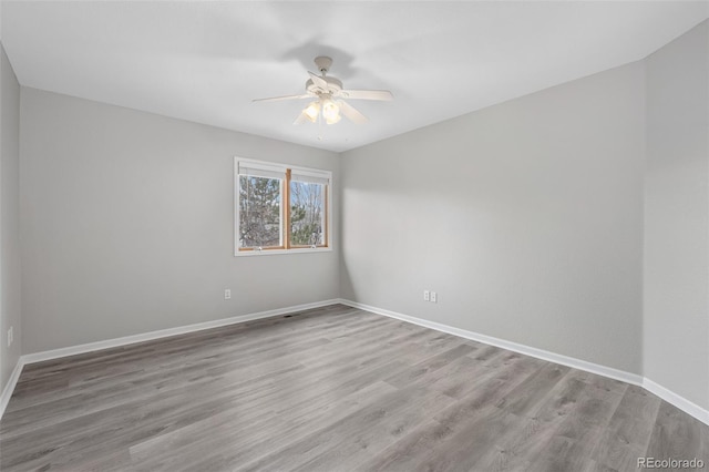 unfurnished room featuring ceiling fan and light hardwood / wood-style flooring