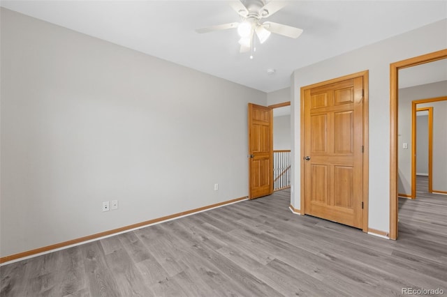 unfurnished bedroom with light hardwood / wood-style floors and ceiling fan