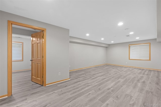 spare room featuring light wood-type flooring