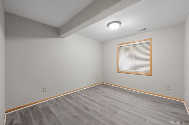 unfurnished room with light hardwood / wood-style flooring