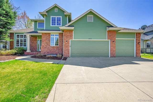 3173 Kingfisher Ct, Fort Collins, CO 80528 - view of front of house with concrete driveway, a front yard, brick siding, and an attached garage