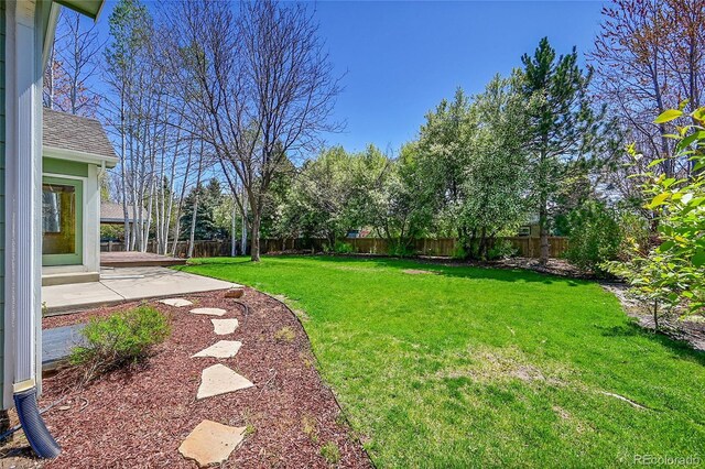 3173 Kingfisher Ct, Fort Collins, CO 80528 - view of yard with a fenced backyard and a patio area