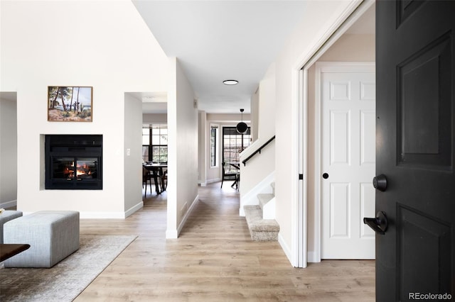 1530 S Quebec Way Unit 24, Denver, CO 80231 - hall featuring light wood-style flooring and stairs