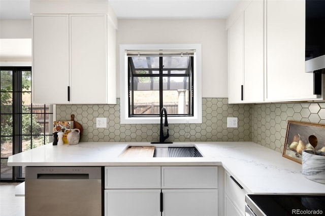 1530 S Quebec Way Unit 24, Denver, CO 80231 - kitchen featuring dishwasher, white cabinetry, and backsplash