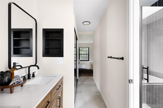 1530 S Quebec Way Unit 24, Denver, CO 80231 - ensuite bathroom featuring double vanity and concrete flooring