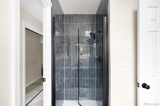 1530 S Quebec Way Unit 24, Denver, CO 80231 - bathroom featuring a stall shower and tile patterned flooring