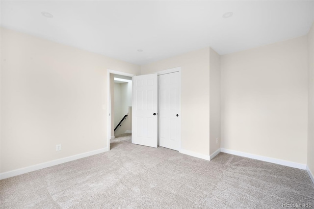 1530 S Quebec Way Unit 24, Denver, CO 80231 - unfurnished bedroom featuring carpet floors and a closet
