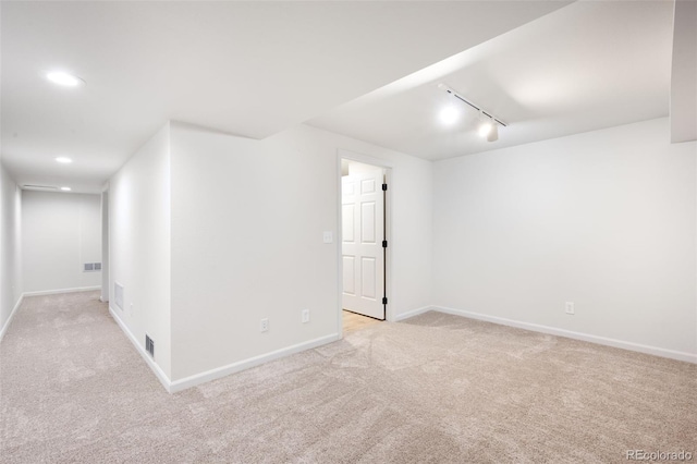 1530 S Quebec Way Unit 24, Denver, CO 80231 - unfurnished room featuring light colored carpet, track lighting, and recessed lighting