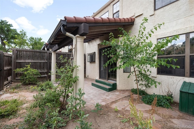 1530 S Quebec Way Unit 24, Denver, CO 80231 - doorway to property with stucco siding