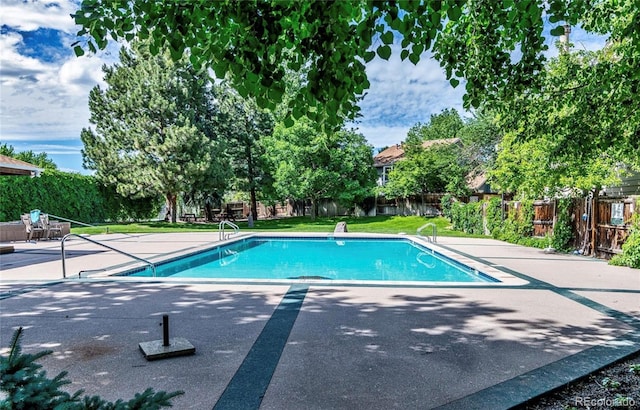 1530 S Quebec Way Unit 24, Denver, CO 80231 - view of swimming pool with a patio