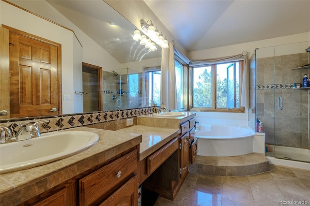 bathroom featuring tile patterned flooring, vanity, lofted ceiling, and shower with separate bathtub