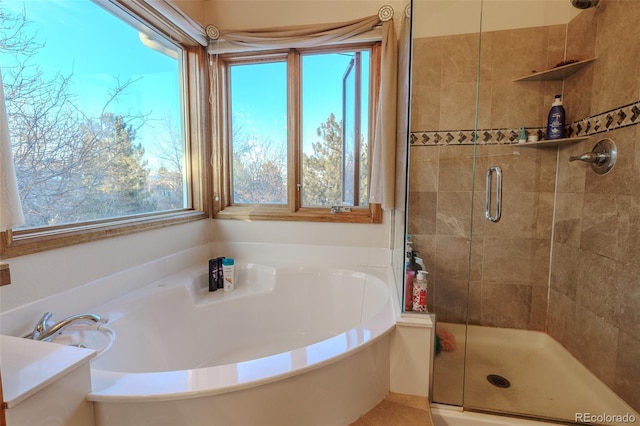 bathroom with shower with separate bathtub