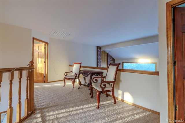 living area with carpet flooring and vaulted ceiling