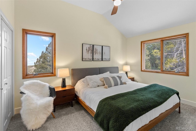 bedroom featuring vaulted ceiling, a closet, ceiling fan, and carpet flooring