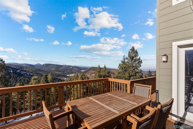 wooden deck featuring a mountain view