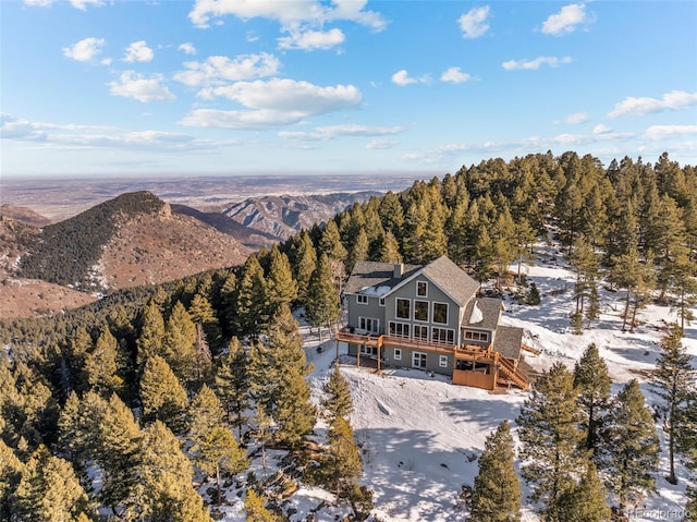 snowy aerial view featuring a mountain view