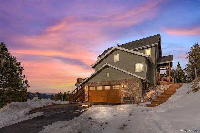 property exterior at dusk with a garage