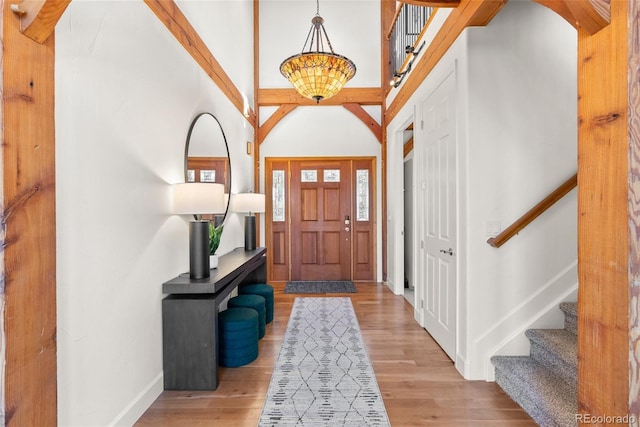 13326 Kuehster Rd, Littleton, CO 80127 - entryway featuring baseboards, stairway, and light wood-type flooring