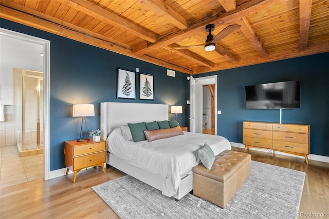 13326 Kuehster Rd, Littleton, CO 80127 - bedroom featuring wooden ceiling with exposed beams, baseboards, wood finished floors, ensuite bath, and ceiling fan