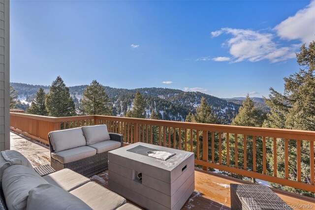 13326 Kuehster Rd, Littleton, CO 80127 - deck with an outdoor living space and a mountain view