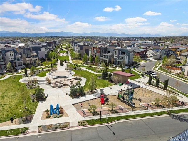 birds eye view of property with a mountain view