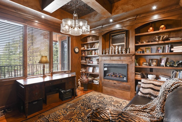 office featuring built in features, hardwood / wood-style floors, coffered ceiling, and a chandelier