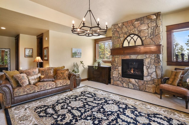 carpeted living room with a fireplace, a textured ceiling, and an inviting chandelier