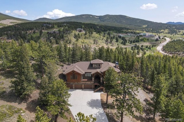 birds eye view of property featuring a mountain view