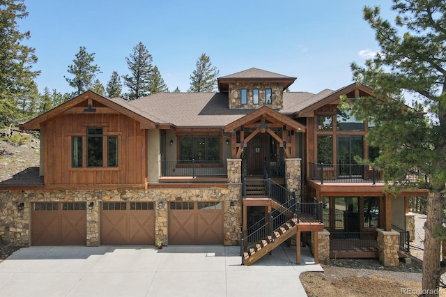 view of front of property with a balcony and a garage