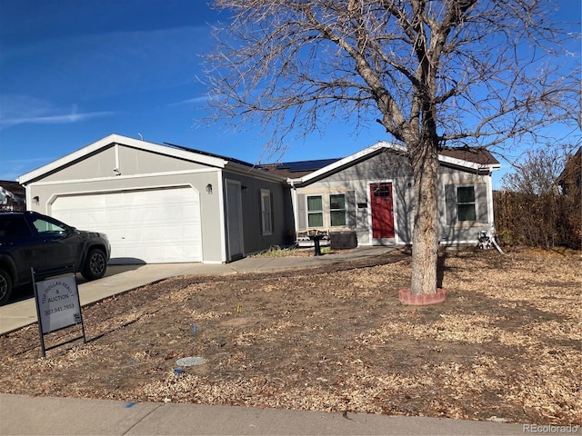 1103 Stage Dr, Fort Lupton, CO 80621 - single story home featuring solar panels, a garage, and concrete driveway