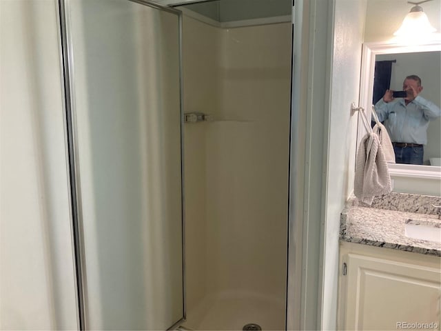 bathroom featuring vanity and walk in shower