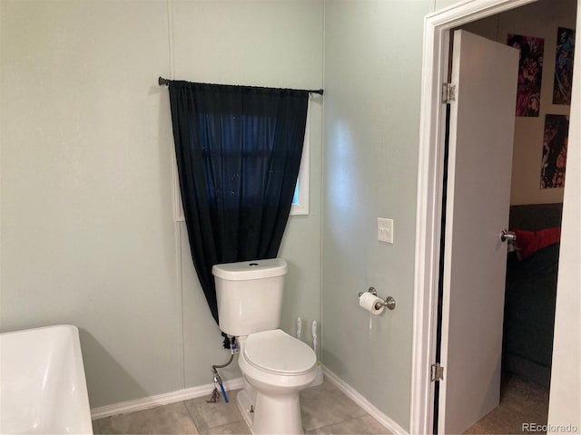 1103 Stage Dr, Fort Lupton, CO 80621 - bathroom with toilet and tile patterned floors