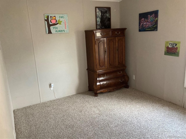 unfurnished bedroom featuring carpet flooring