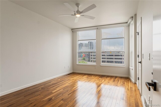 2680 Blake St Unit 4, Denver, CO 80205 - unfurnished room featuring hardwood / wood-style flooring and ceiling fan
