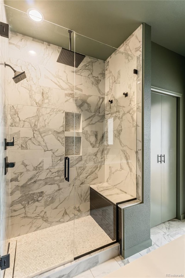 2680 Blake St Unit 4, Denver, CO 80205 - bathroom featuring a marble finish shower and marble finish floors