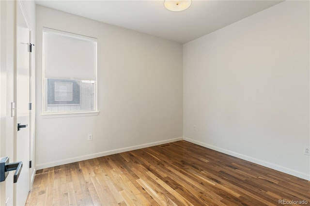 2680 Blake St Unit 4, Denver, CO 80205 - spare room featuring hardwood / wood-style floors and baseboards