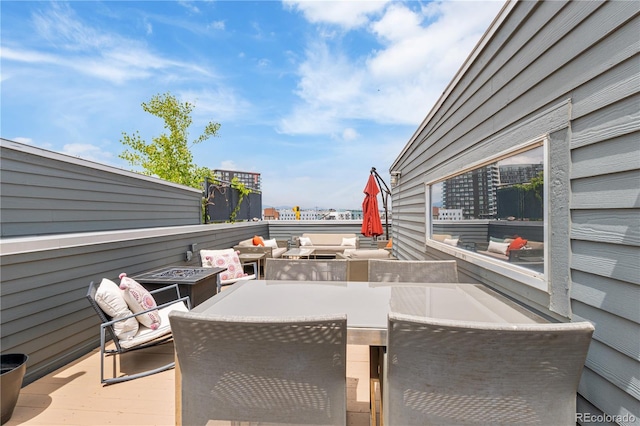 2680 Blake St Unit 4, Denver, CO 80205 - view of patio featuring an outdoor living space with a fire pit and outdoor dining space