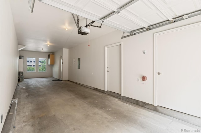 2680 Blake St Unit 4, Denver, CO 80205 - garage featuring a garage door opener and electric panel