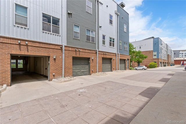 2680 Blake St Unit 4, Denver, CO 80205 - view of building exterior with a garage and driveway