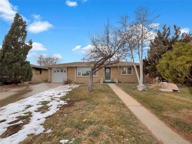 view of front of property with a garage and a front lawn