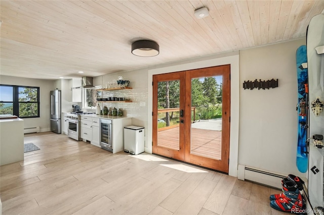 8940 S Brandenburger Dr, Morrison, CO 80465 - kitchen featuring appliances with stainless steel finishes, wine cooler, a baseboard heating unit, wooden ceiling, and white cabinets