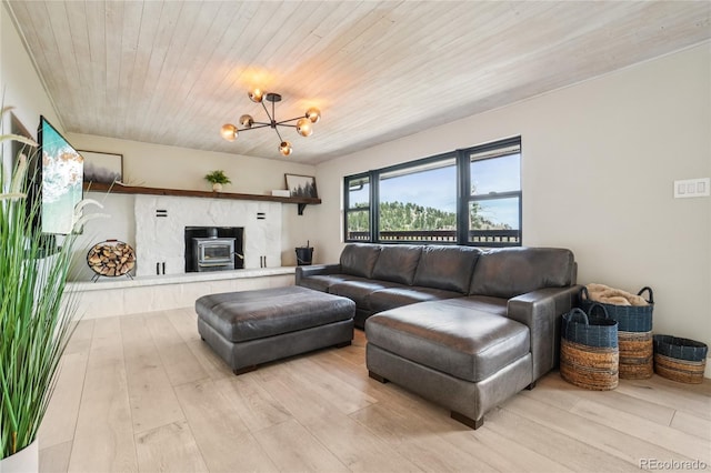 8940 S Brandenburger Dr, Morrison, CO 80465 - living area with light wood finished floors, a chandelier, and wooden ceiling