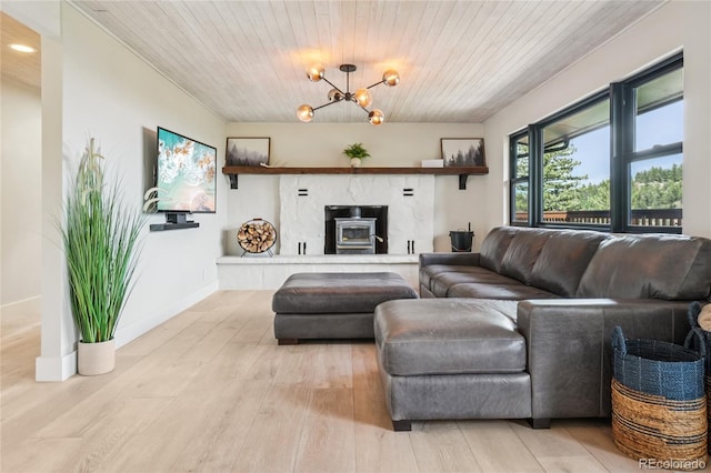 8940 S Brandenburger Dr, Morrison, CO 80465 - living room featuring wood ceiling, light wood-type flooring, a chandelier, and recessed lighting